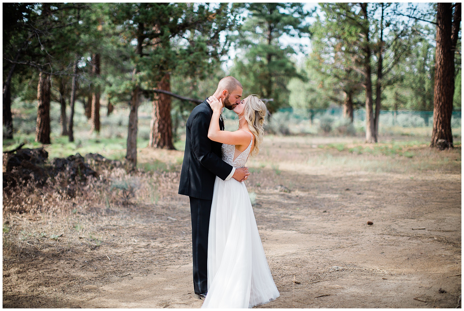 A portrait of the newlyweds sharing an intimate kiss after their backyard wedding ceremony in Bend, Oregon. 