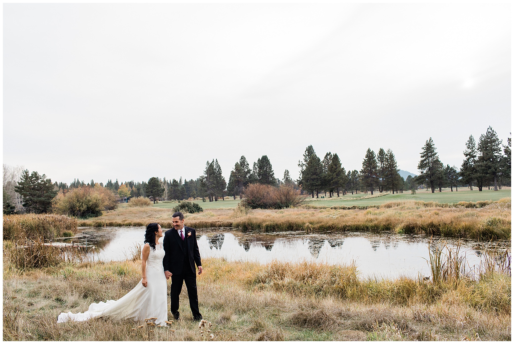 Portrait of the couple walking through the Sunriver Resort Fall Riverfront